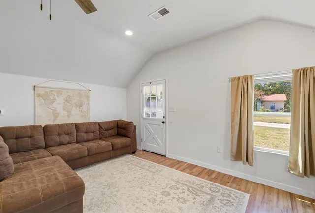 a living room with furniture and a window