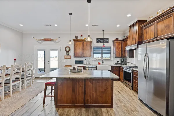 a bathroom with a granite countertop sink a mirror and vanity