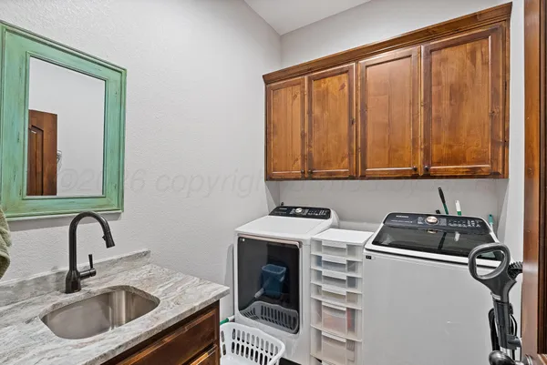a view of a workspace with furniture and front door