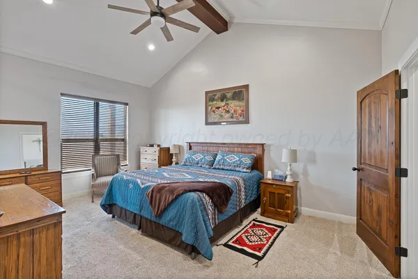 a bedroom with two beds and a window