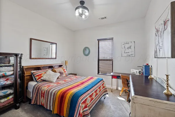 a view of a hallway with a furniture and a window