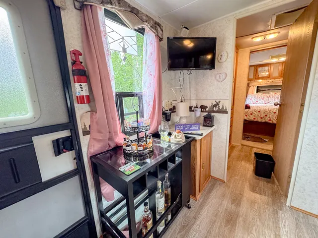 a kitchen with stainless steel appliances a stove a sink and a refrigerator