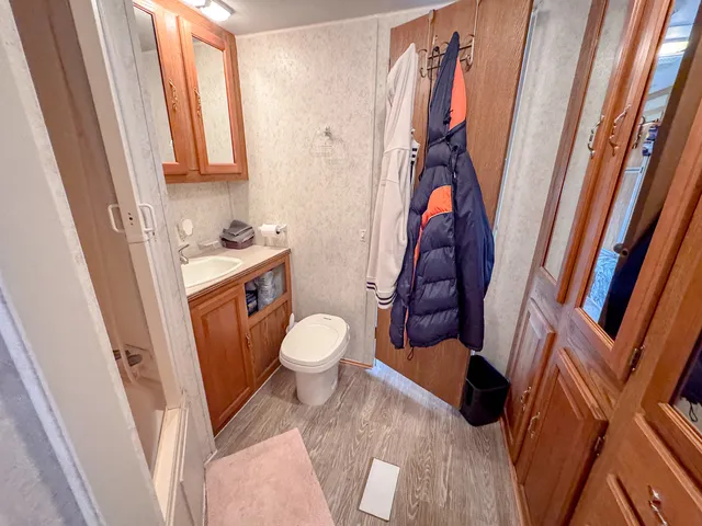 a bathroom with a toilet and a shower