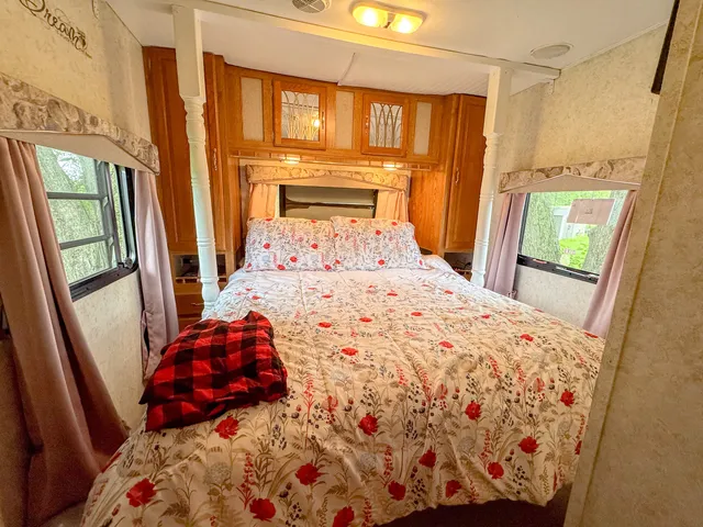 a bedroom with a bed and a window