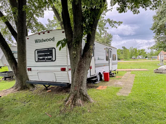 a view of a backyard with a garden and entertaining space