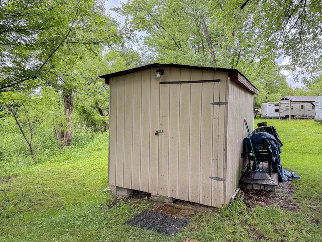 a view of a backyard with pathway