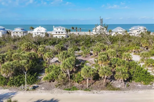 a front view of a house with a yard and mountain view