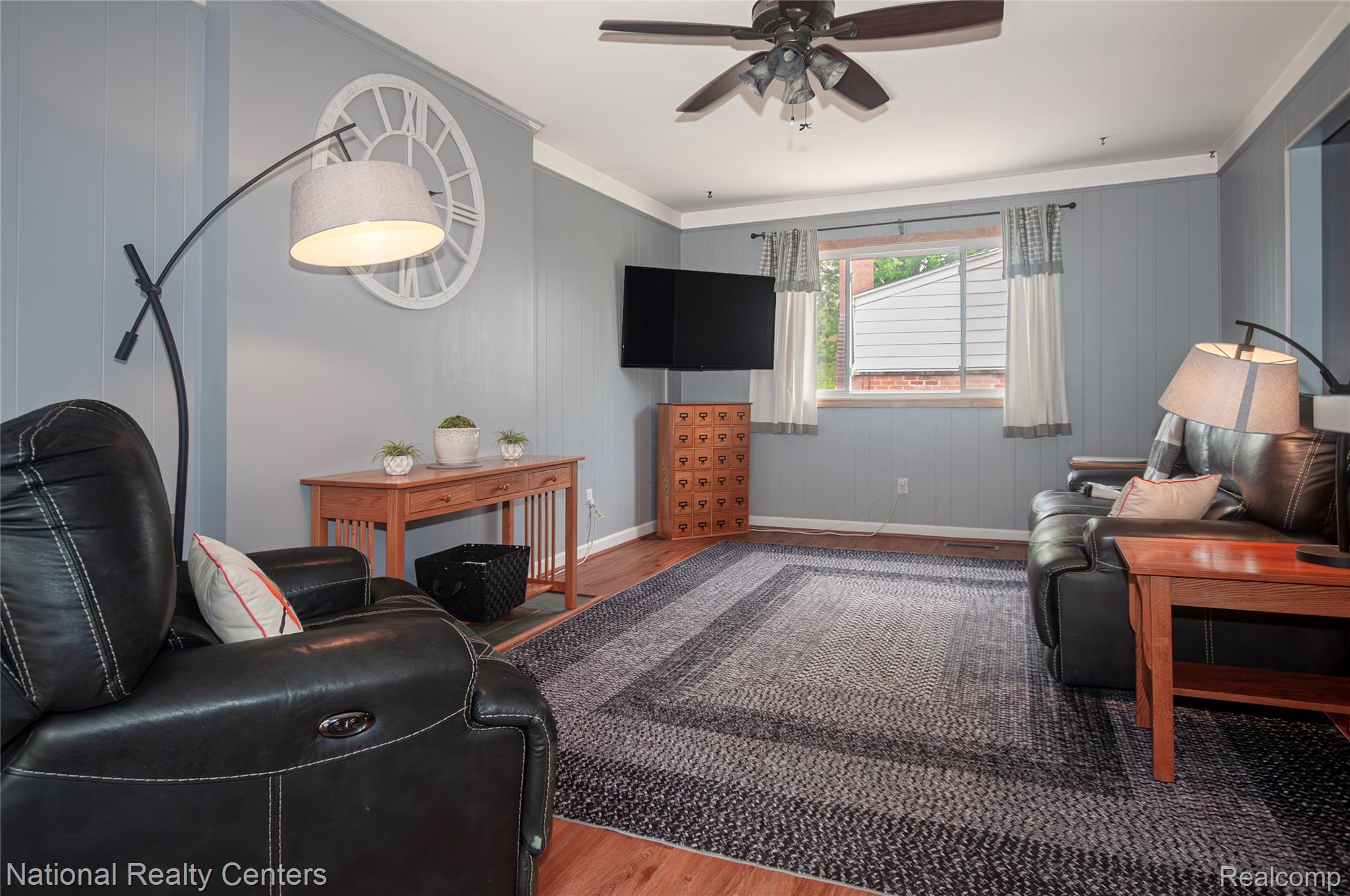 2446 Milverton Road Troy, MI 48083 - Photo 13 of 41 Living area with wood finished floors, ceiling fan, and ornamental molding
