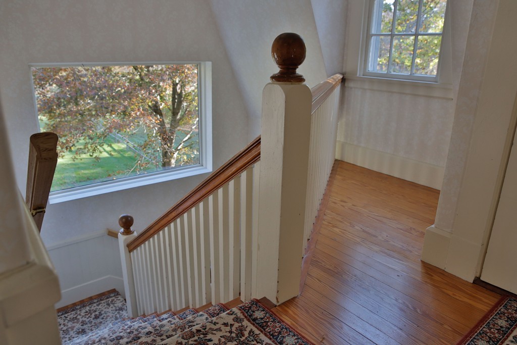 15 Leather Lane Beverly, MA 01915 - Photo 16 of 24 a view of a hallway with wooden floor and a window