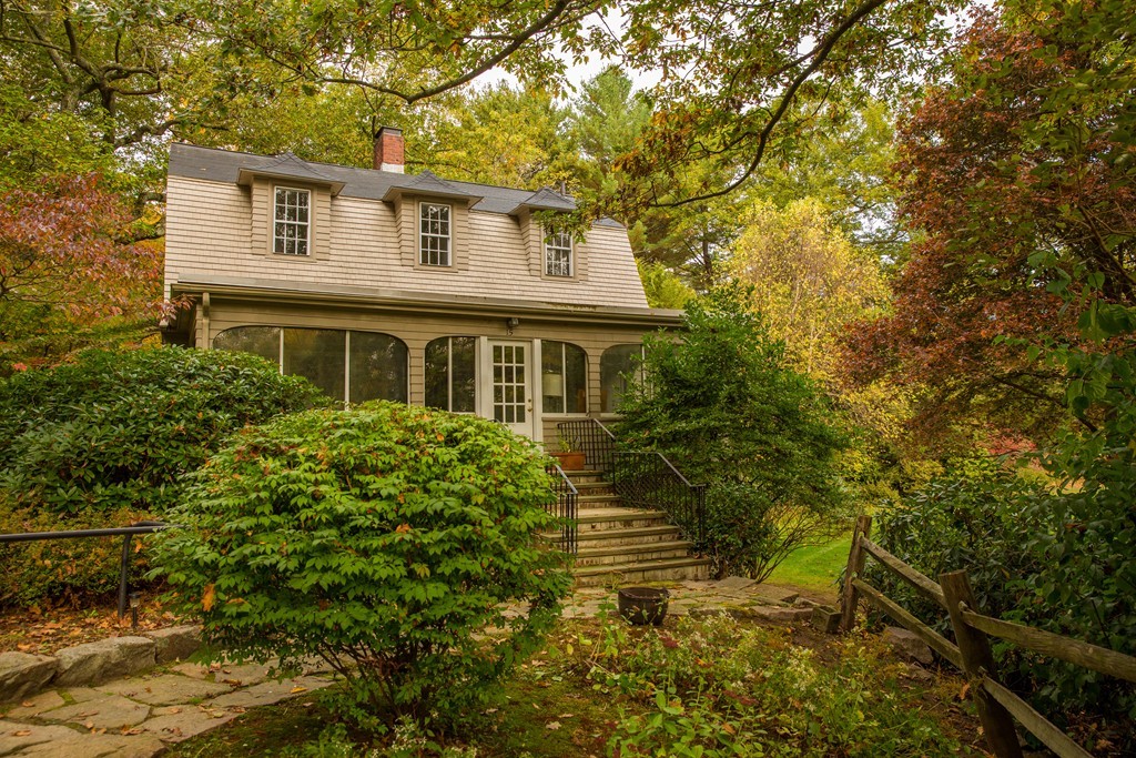 15 Leather Lane Beverly, MA 01915 - Photo 3 of 24 a yellow house with trees in front of it