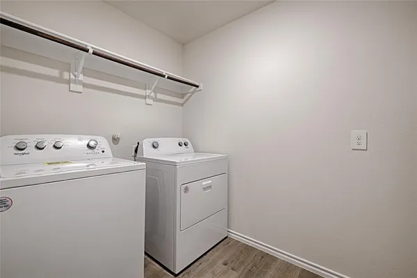 a view of an house with backyard and porch