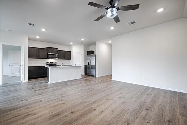 a view of a kitchen with a sink and a microwave