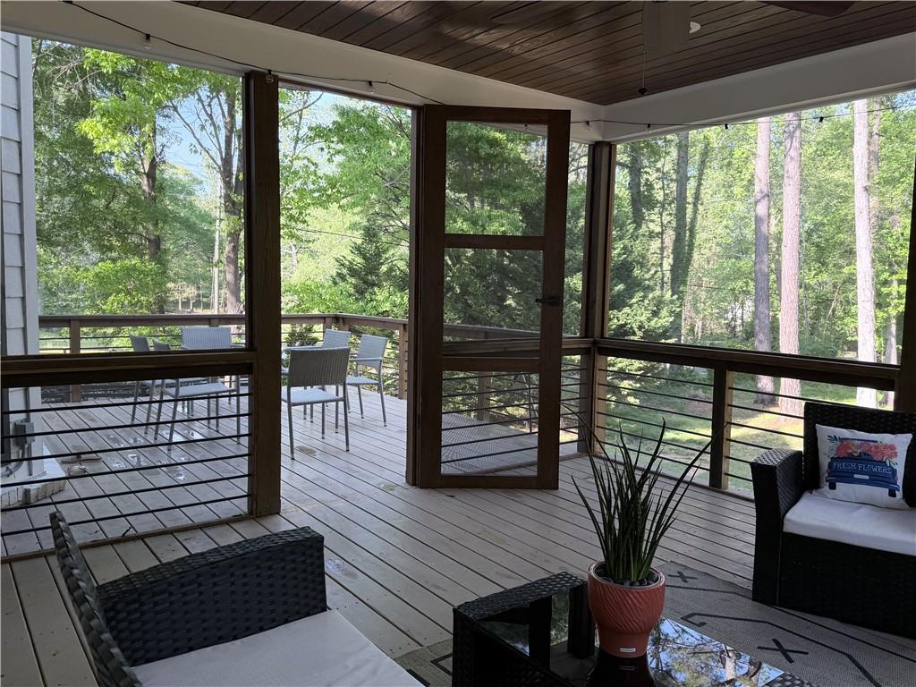 1600 Reddstone Cl Milton, GA 30004 - Photo 102 of 102 a view of a dining room with furniture window and wooden floor