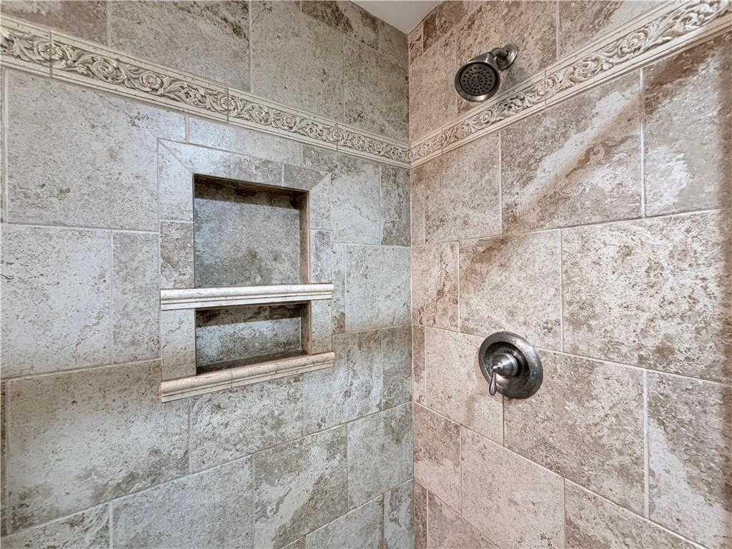 1600 Reddstone Cl Milton, GA 30004 - Photo 77 of 102 a bathroom with a shower