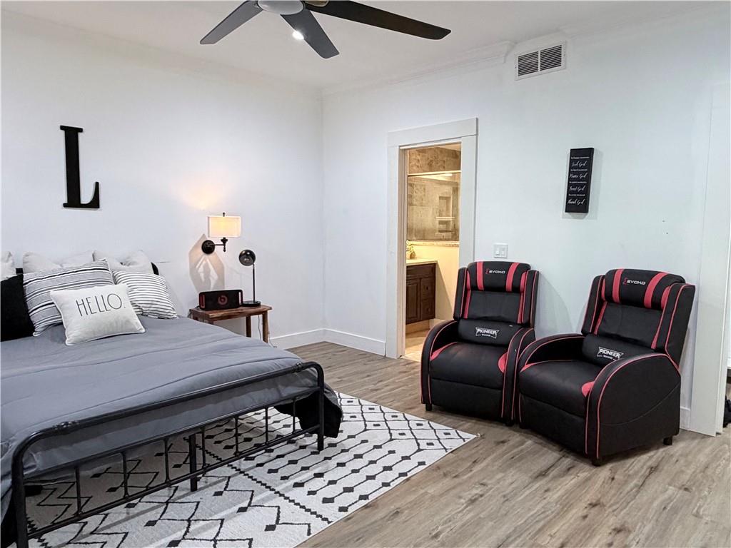 1600 Reddstone Cl Milton, GA 30004 - Photo 85 of 102 a bedroom with furniture and wooden floor
