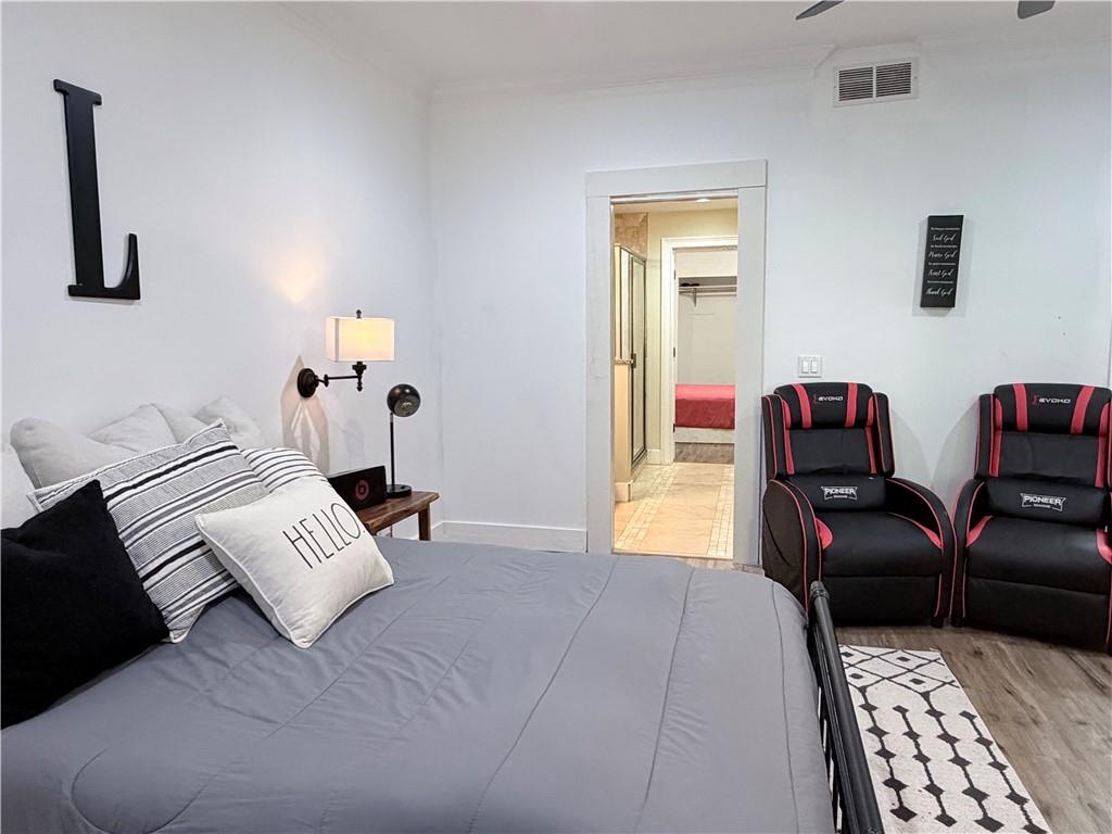 1600 Reddstone Cl Milton, GA 30004 - Photo 86 of 102 a bedroom with furniture and a couch