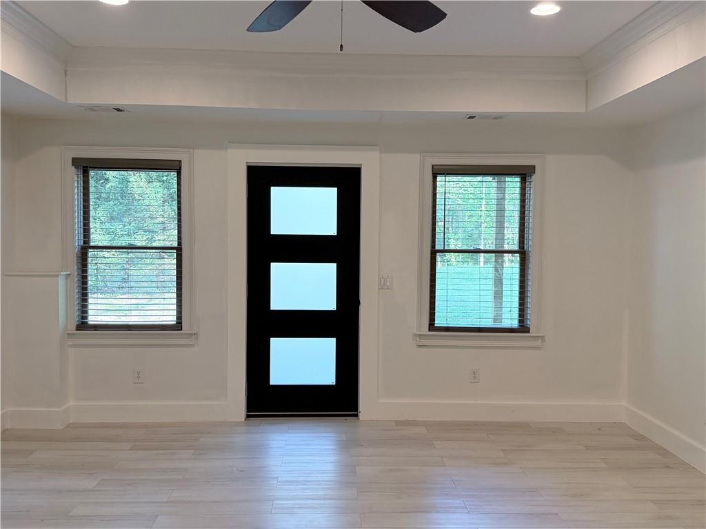 1600 Reddstone Cl Milton, GA 30004 - Photo 90 of 102 a view of an empty room with wooden floor and a window