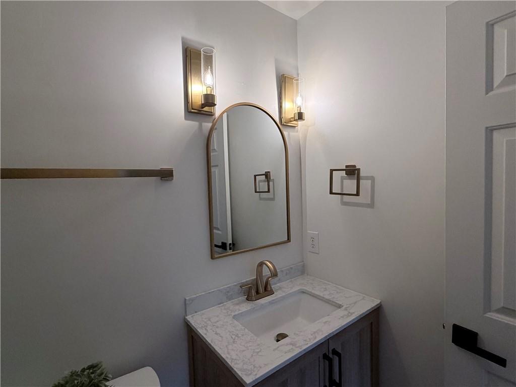 1600 Reddstone Cl Milton, GA 30004 - Photo 96 of 102 a bathroom with a sink and a mirror