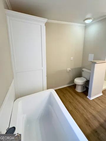 a kitchen with a stove and a refrigerator