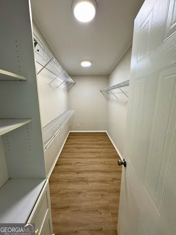 a kitchen with a refrigerator and a microwave