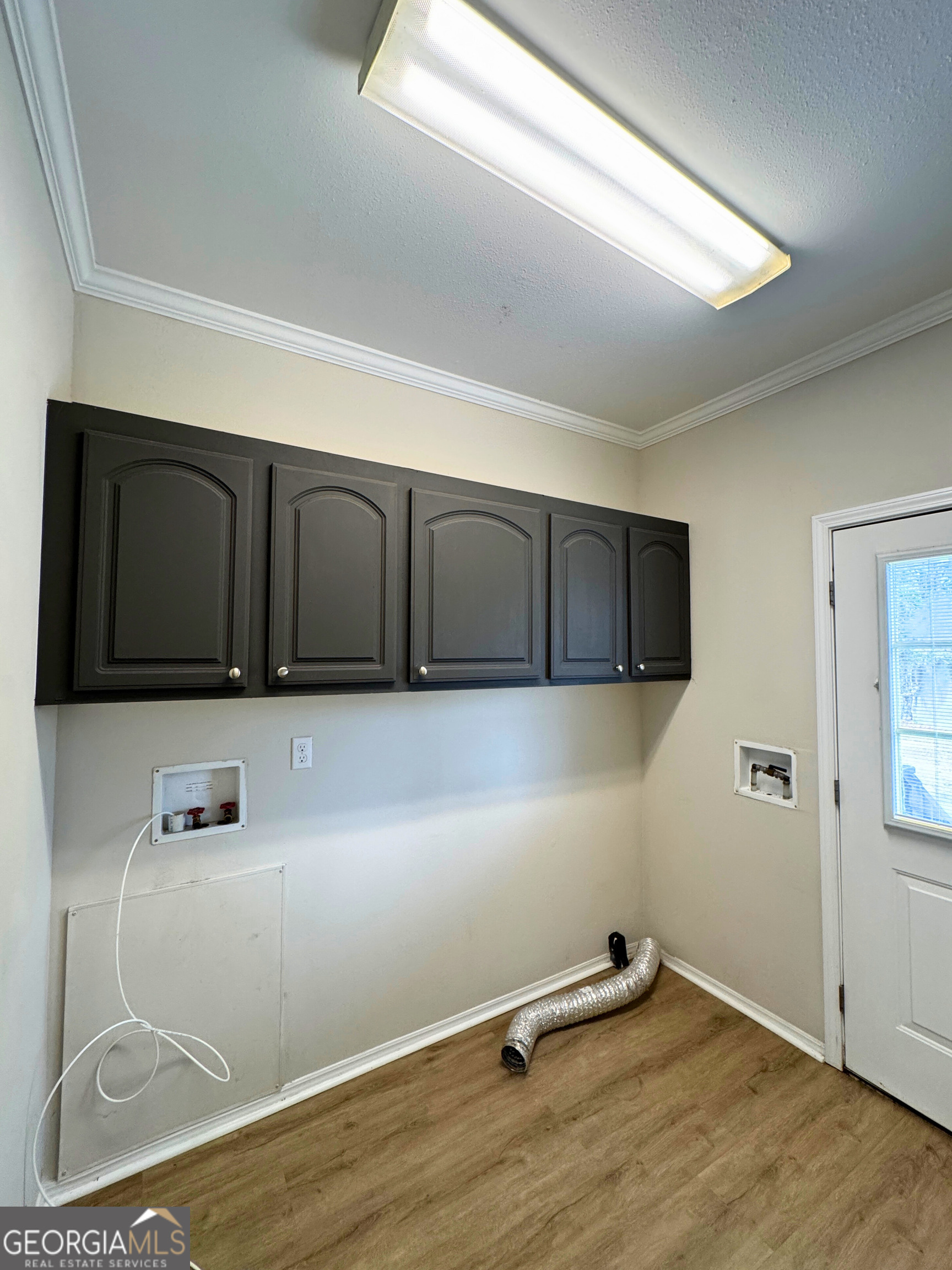 2554 Harrietts Bluff Road Woodbine, GA 31569 - Photo 21 of 35 a kitchen with a refrigerator and a microwave