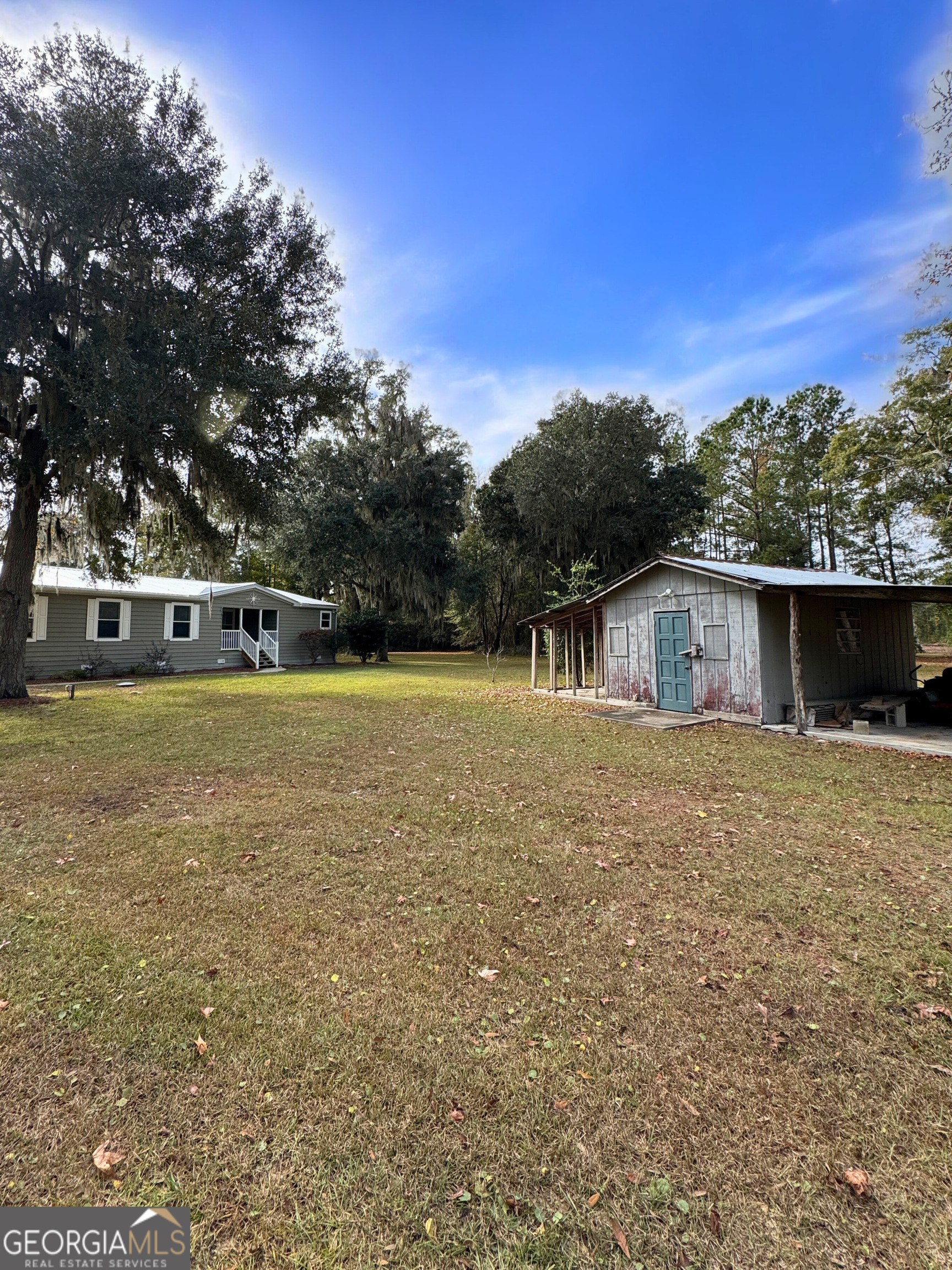 2554 Harrietts Bluff Road Woodbine, GA 31569 - Photo 33 of 35 a view of a house with a yard