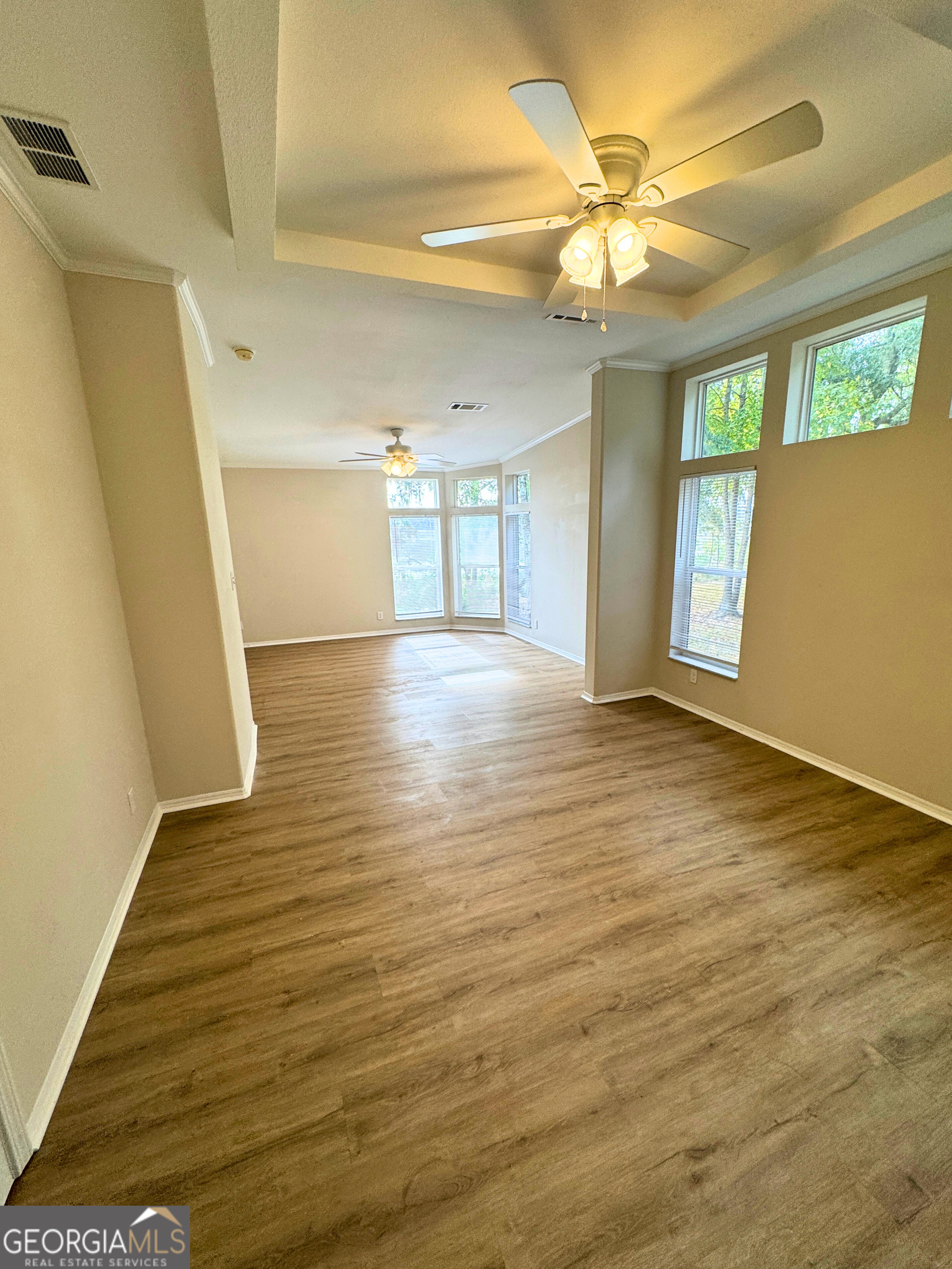 2554 Harrietts Bluff Road Woodbine, GA 31569 - Photo 7 of 35 a view of an empty room with window and wooden floor