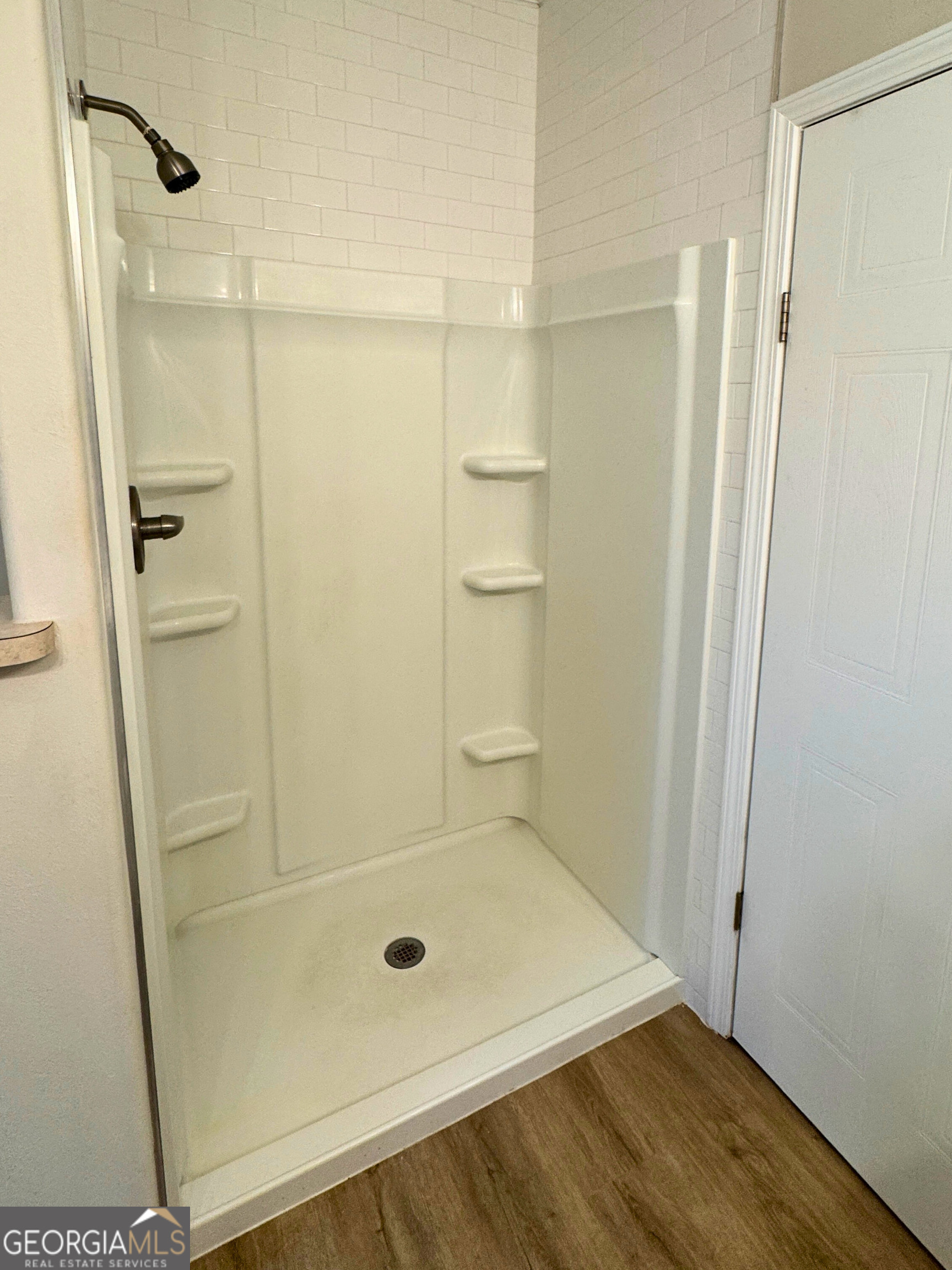 2554 Harrietts Bluff Road Woodbine, GA 31569 - Photo 10 of 35 a bathroom with a glass shower door