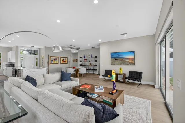 a kitchen with counter top space and view living room