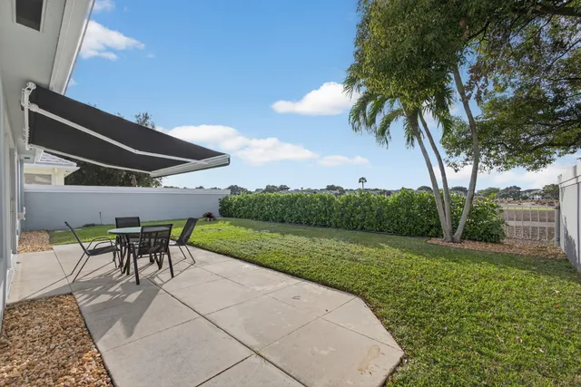 a front view of house with yard and seating area