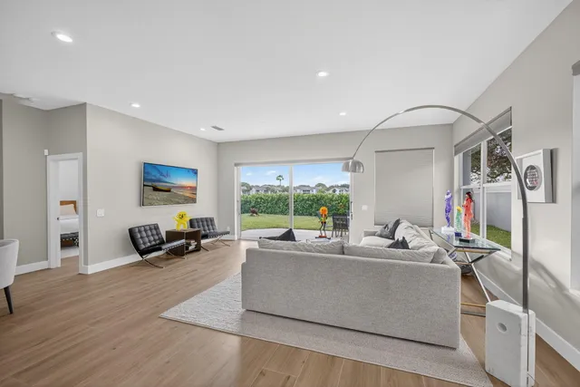 a living room with furniture and a large window