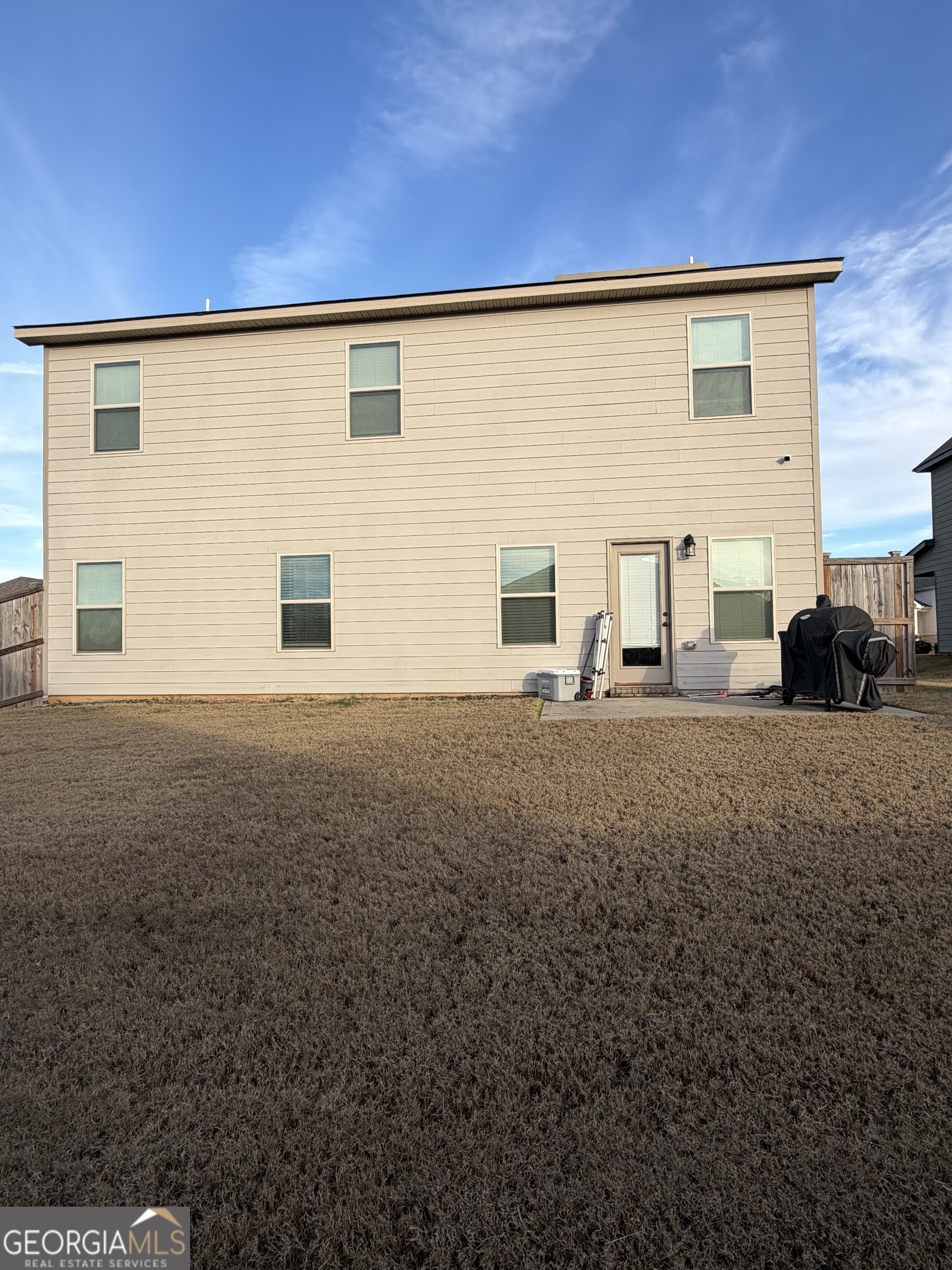 1700 Cadence Street Locust Grove, GA 30248 - Photo 2 of 2 a view of a house with backyard