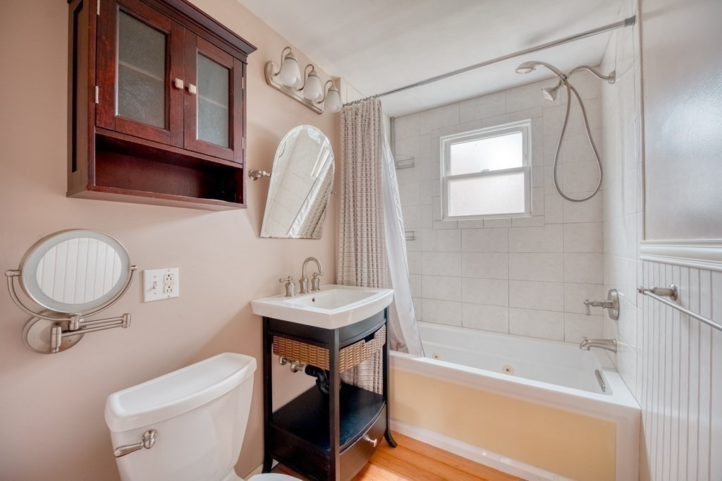 150 Louis Road Springfield, MA 01118 - Photo 15 of 39 a bathroom with a sink a toilet and a mirror