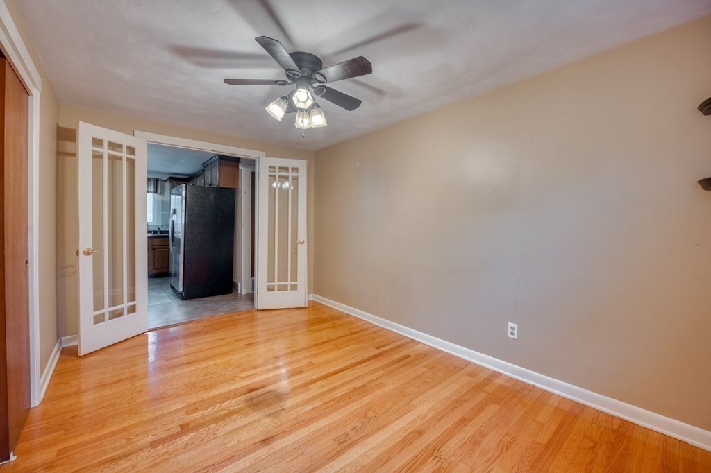 150 Louis Road Springfield, MA 01118 - Photo 21 of 39 a view of an empty room with wooden floor