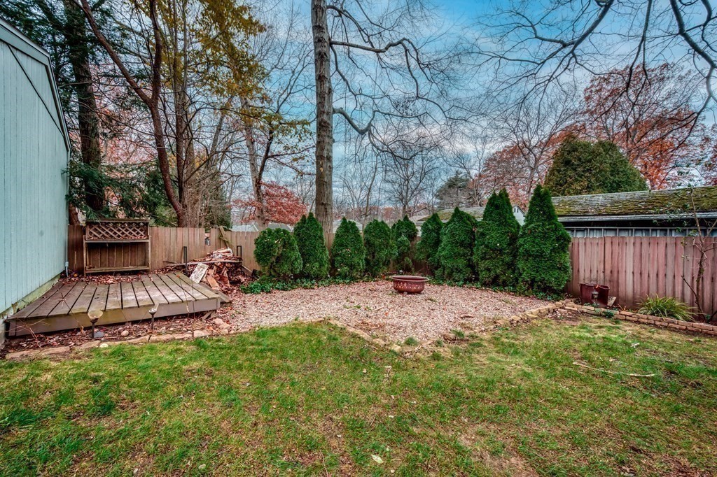150 Louis Road Springfield, MA 01118 - Photo 26 of 39 a view of a backyard with potted plants and large trees