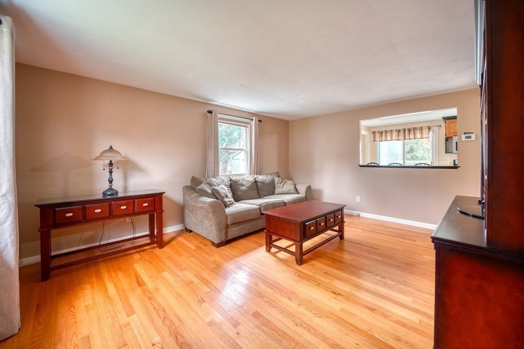 150 Louis Road Springfield, MA 01118 - Photo 4 of 39 a living room with furniture and a wooden floor