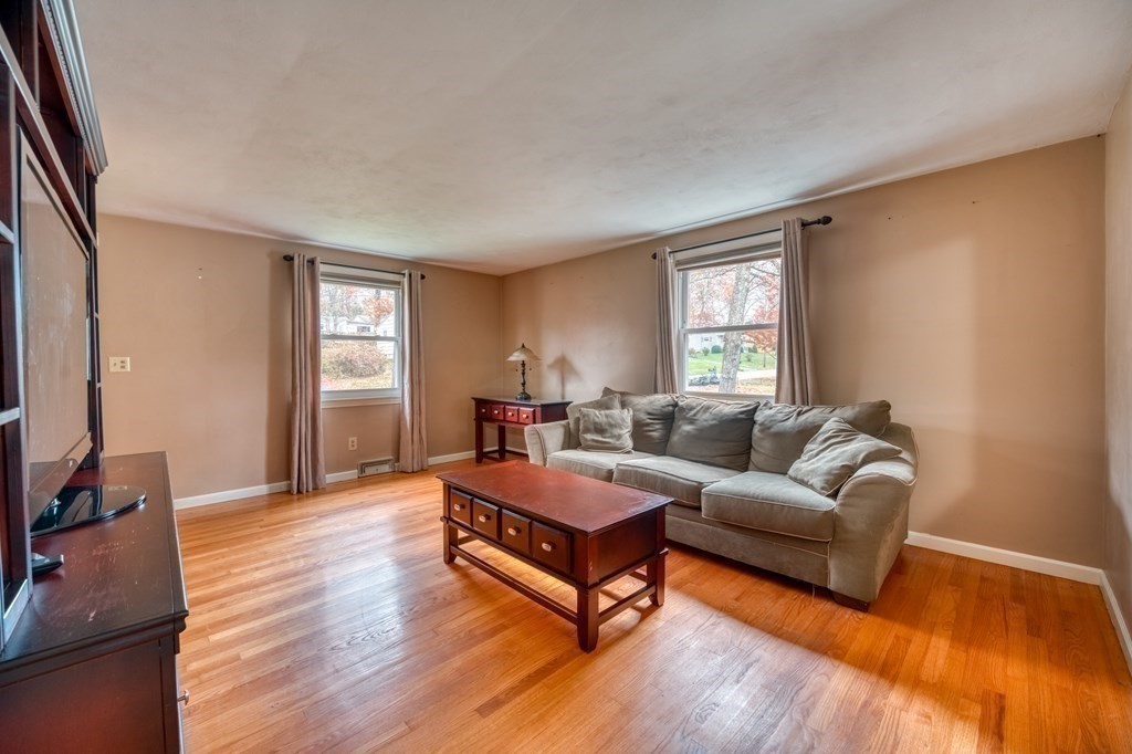 150 Louis Road Springfield, MA 01118 - Photo 10 of 39 a living room with furniture window and wooden floor