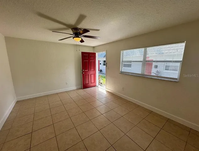 a view of an empty room with a window