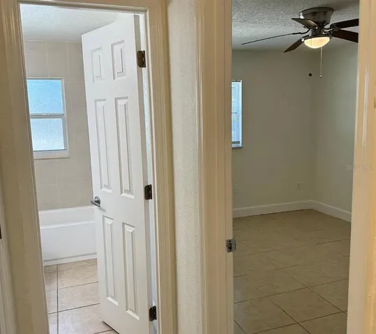 a view of a bathroom from a hallway