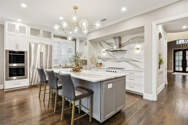 a kitchen with a table and chairs
