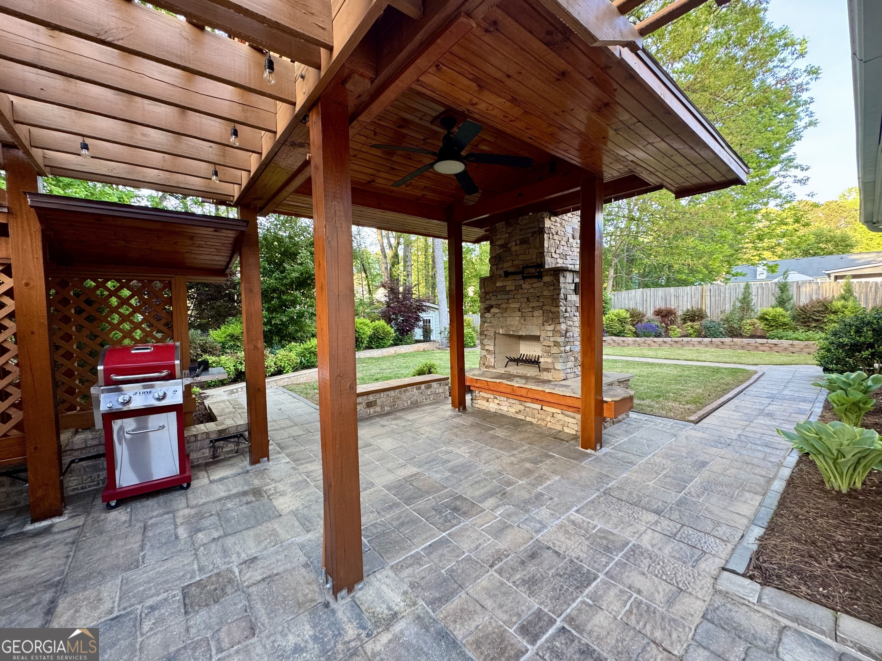 128 Lake Cove Approach Newnan, GA 30265 - Photo 13 of 63 a view of a porch with furniture and a yard