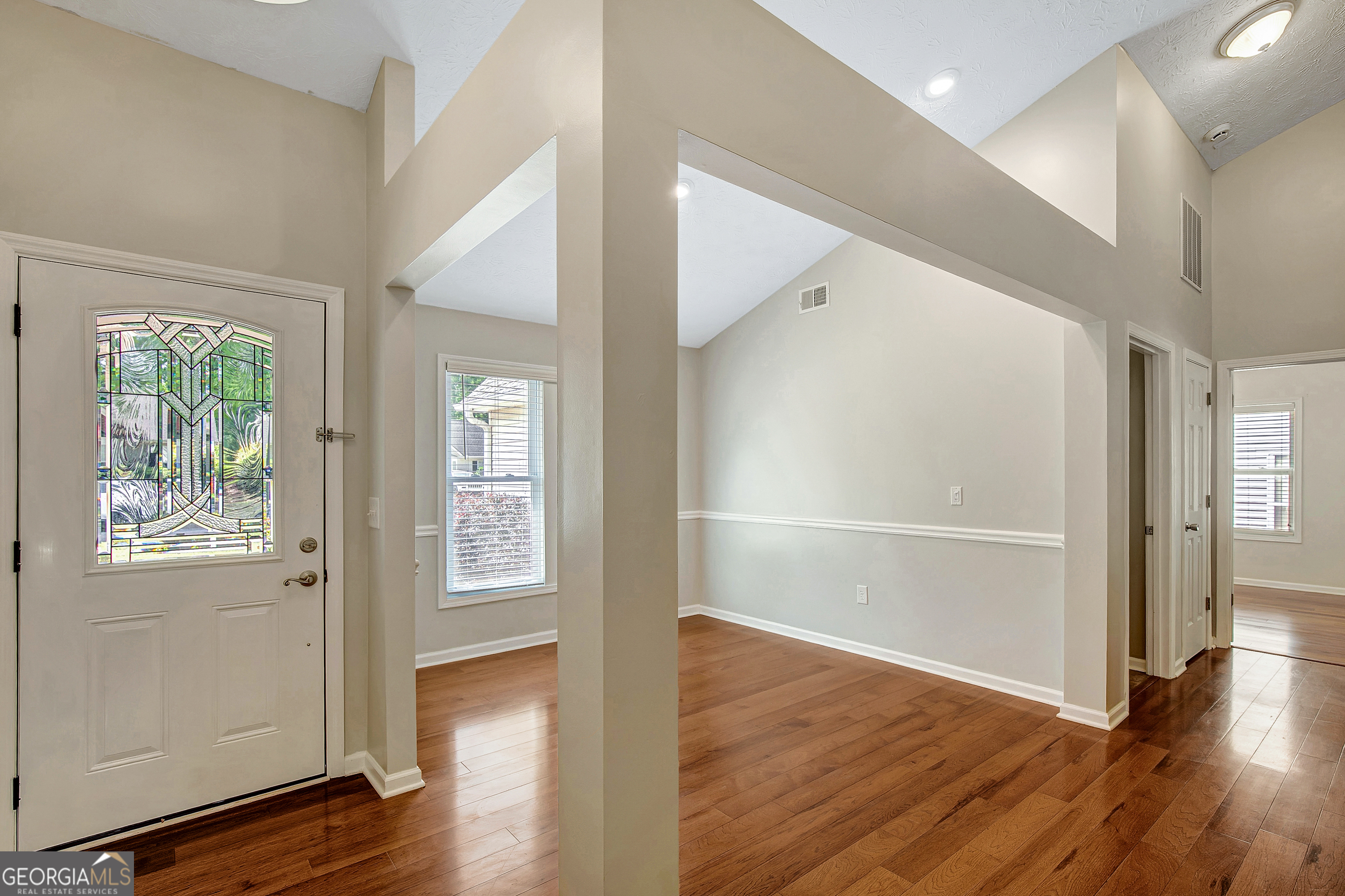 128 Lake Cove Approach Newnan, GA 30265 - Photo 14 of 63 an empty room with wooden floor and windows