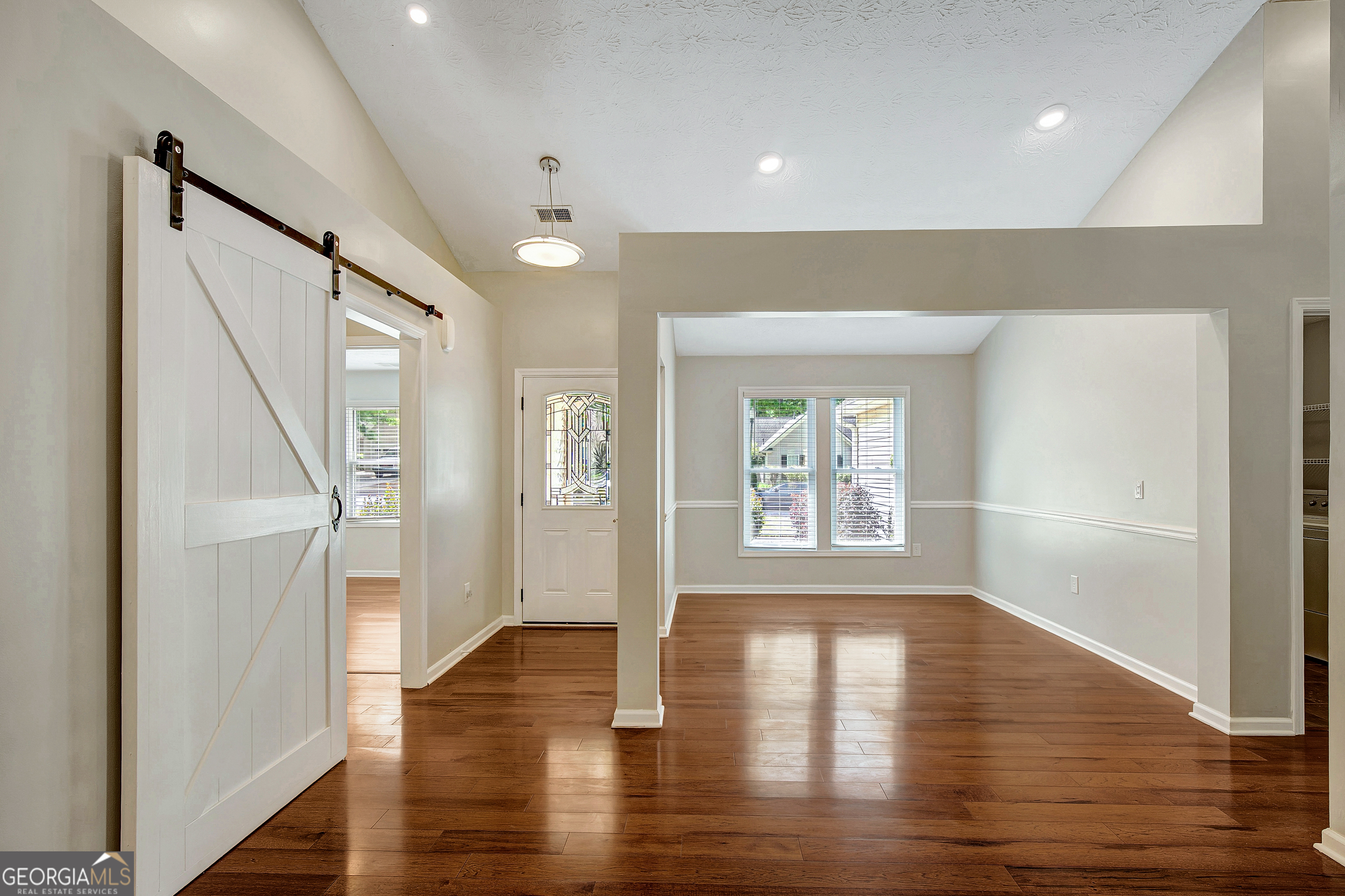 128 Lake Cove Approach Newnan, GA 30265 - Photo 15 of 63 a view of an empty room with wooden floor and a window
