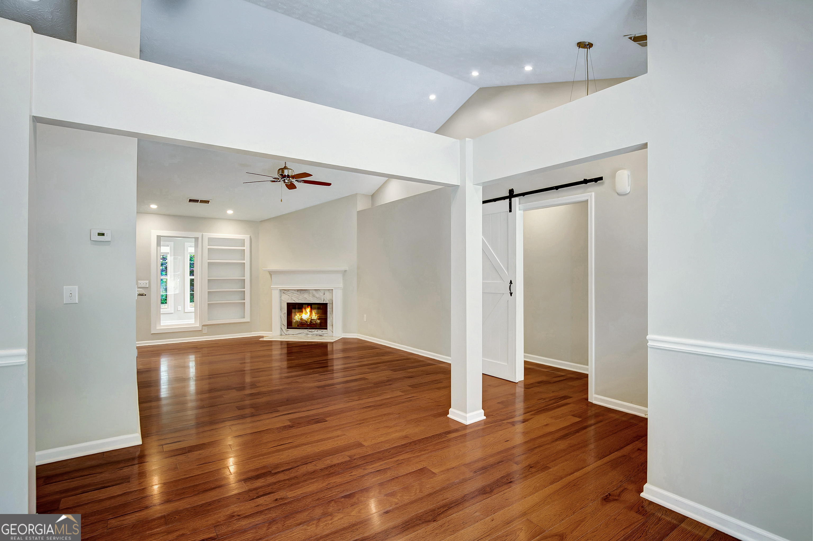 128 Lake Cove Approach Newnan, GA 30265 - Photo 17 of 63 a view of empty room with wooden floor