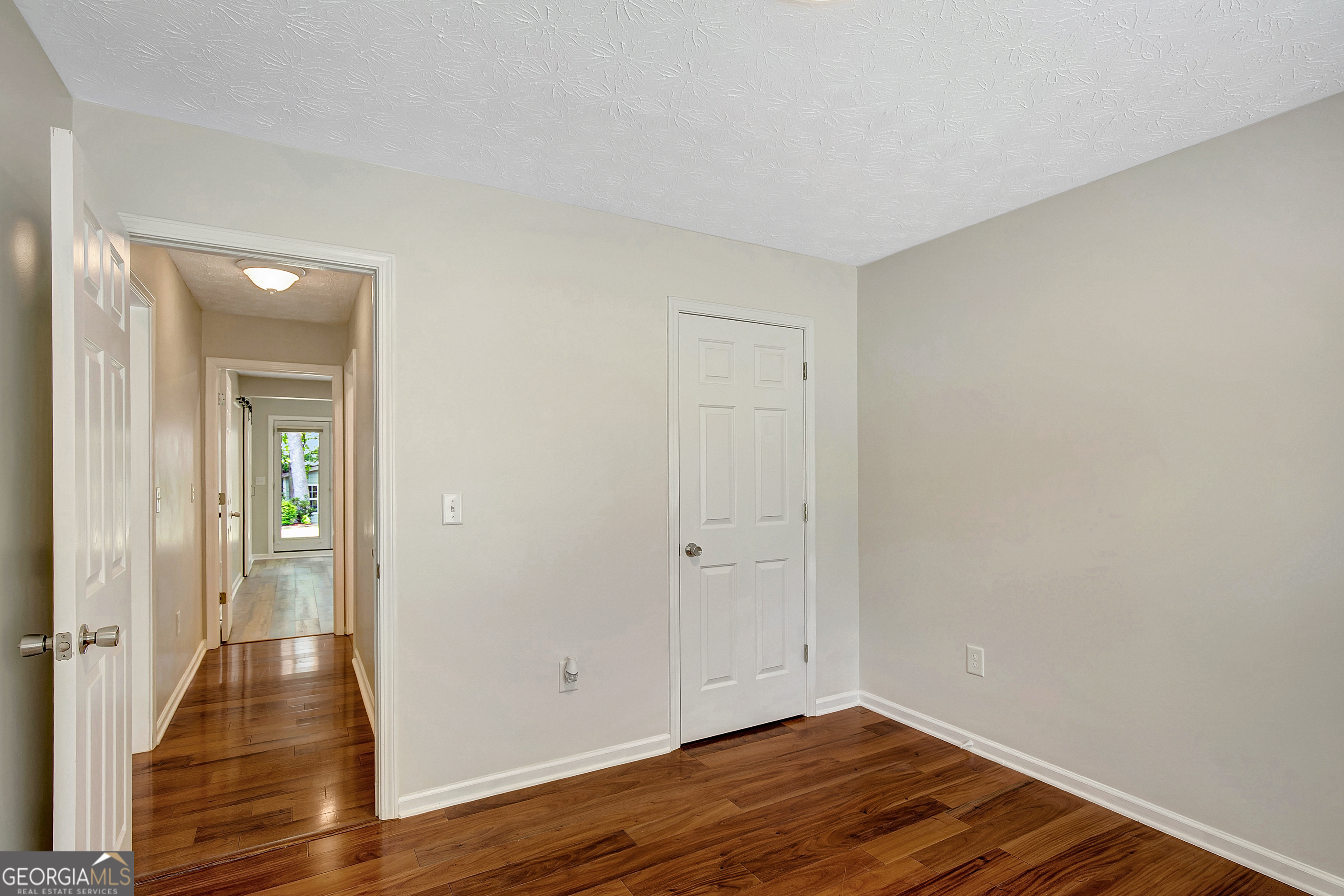 128 Lake Cove Approach Newnan, GA 30265 - Photo 21 of 63 wooden floor in an empty room