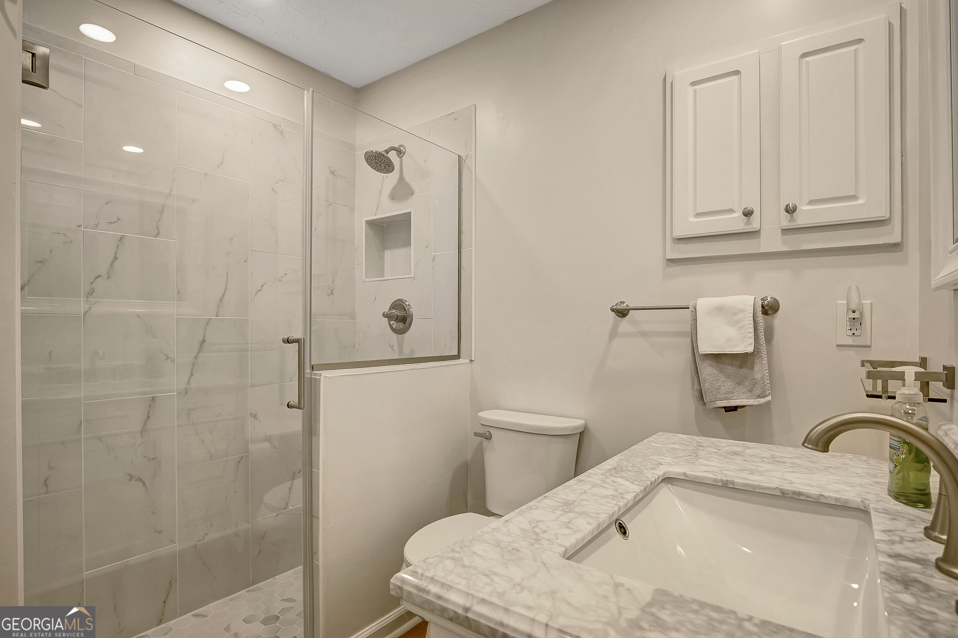 128 Lake Cove Approach Newnan, GA 30265 - Photo 24 of 63 a bathroom with a sink a toilet and shower