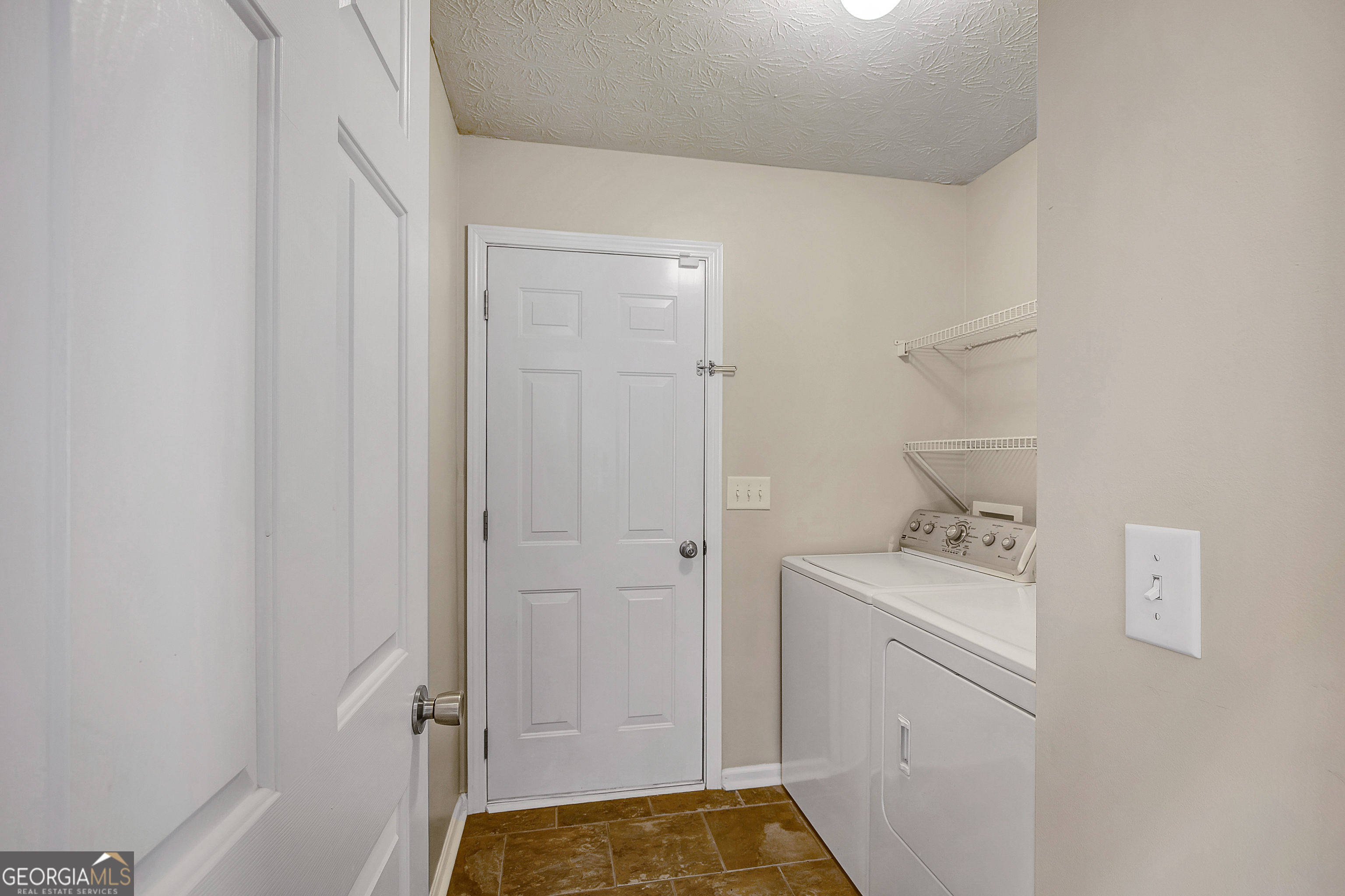 128 Lake Cove Approach Newnan, GA 30265 - Photo 37 of 63 a bathroom with a sink a toilet and shower
