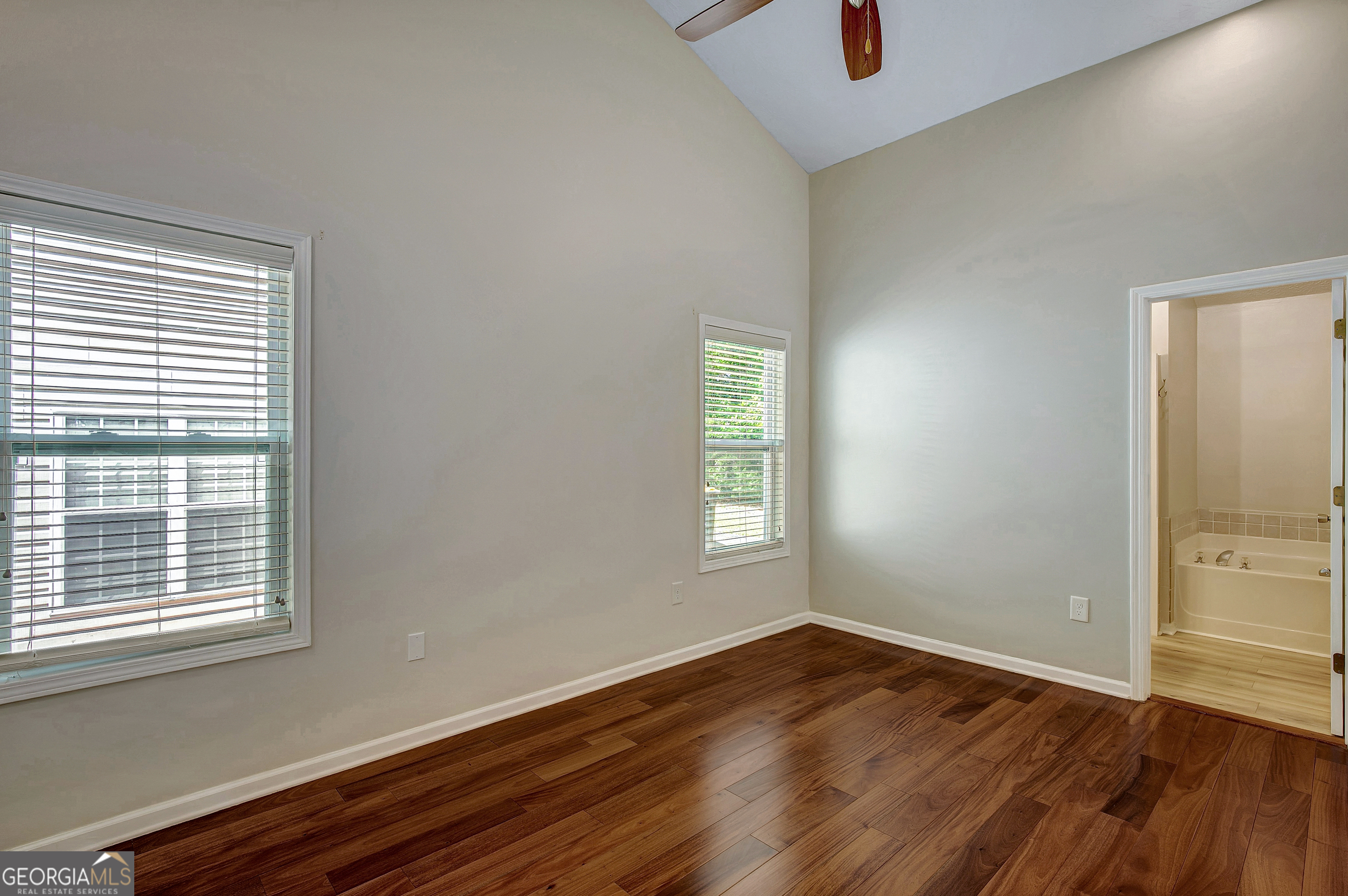 128 Lake Cove Approach Newnan, GA 30265 - Photo 38 of 63 a view of an empty room with wooden floor and a window