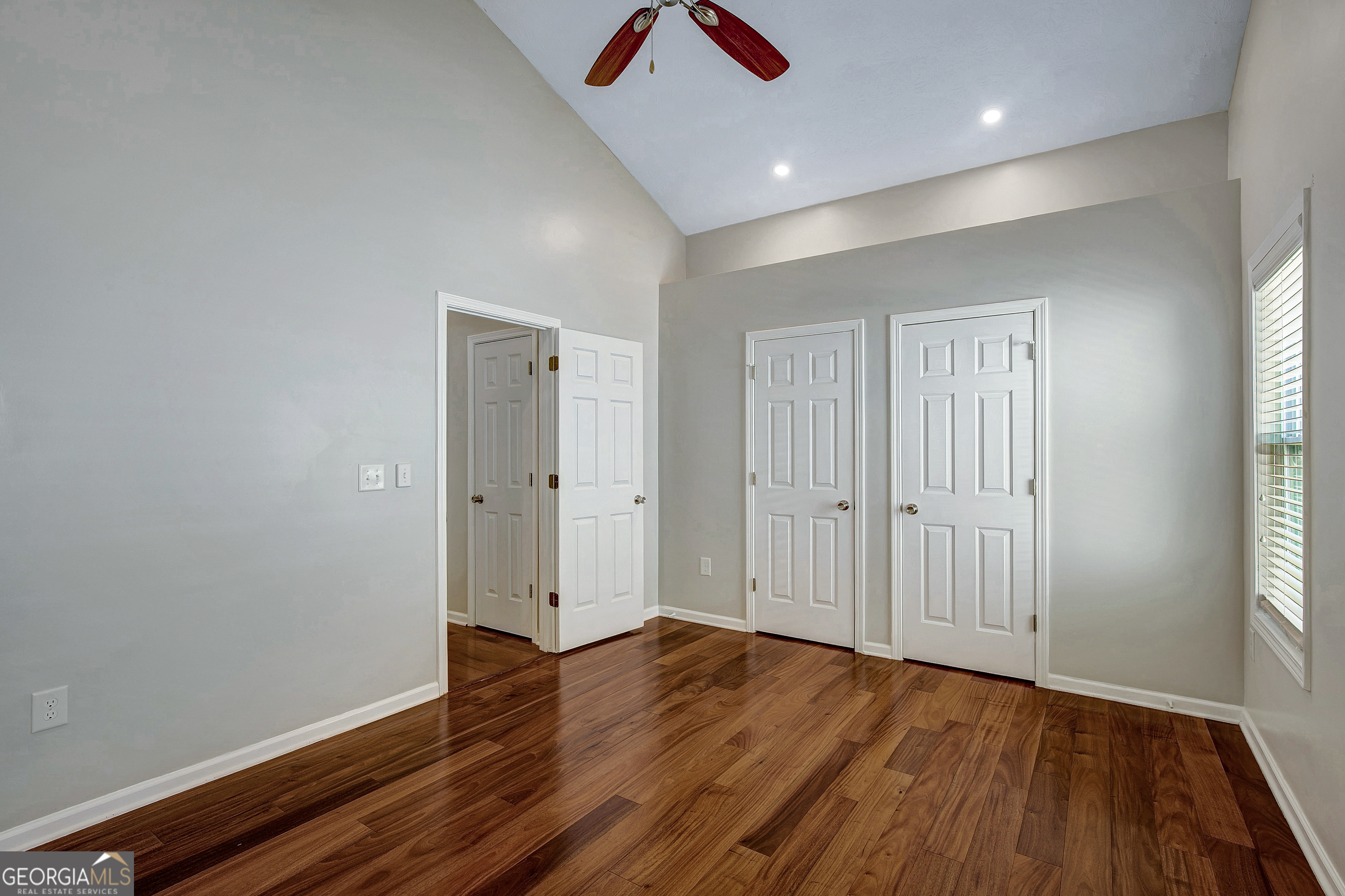 128 Lake Cove Approach Newnan, GA 30265 - Photo 39 of 63 an empty room with wooden floor and windows