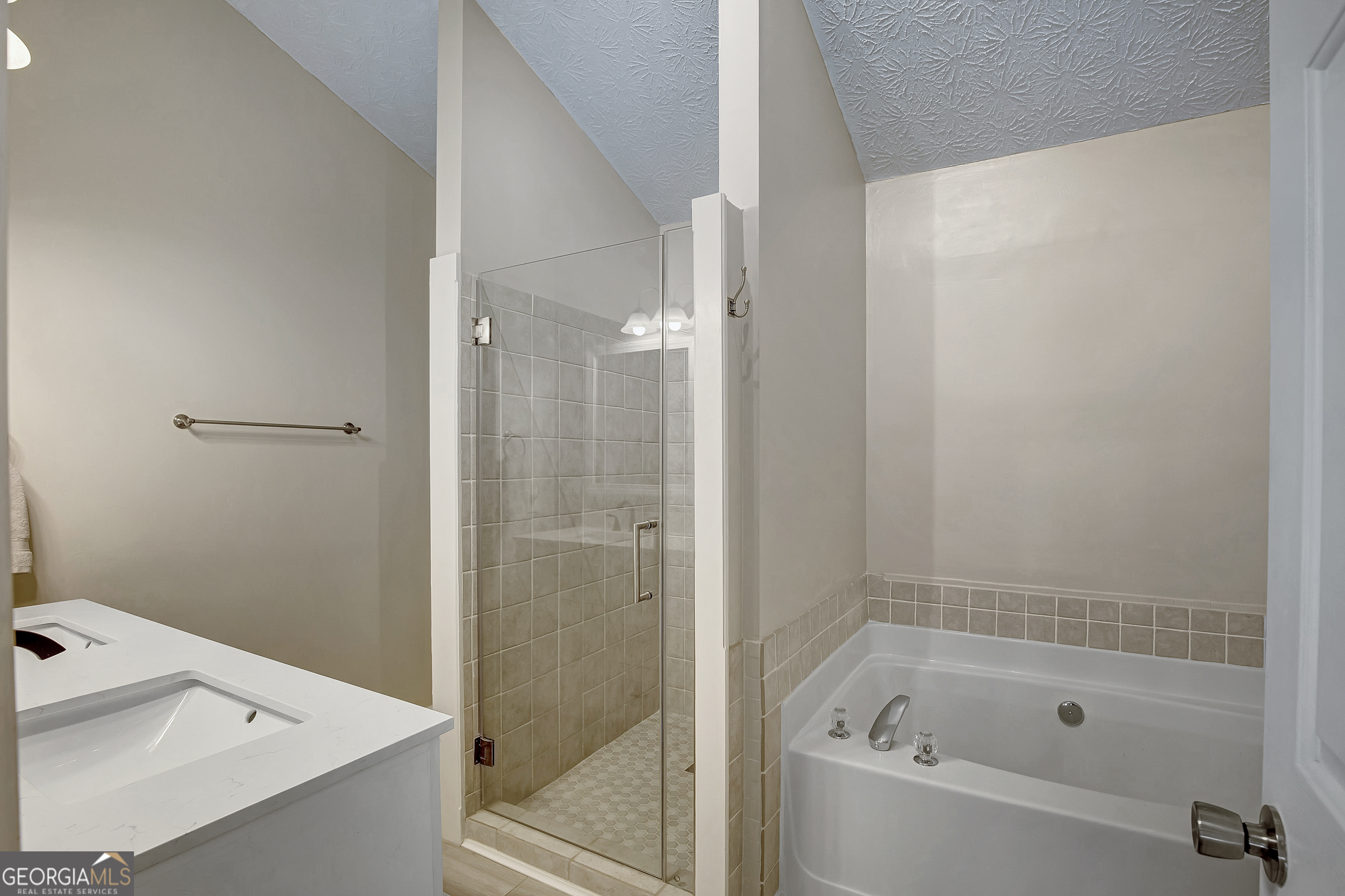 128 Lake Cove Approach Newnan, GA 30265 - Photo 40 of 63 a bathroom with a bathtub and a shower